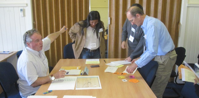 Participants acting out roles as part of the facilitation tabletop exercise